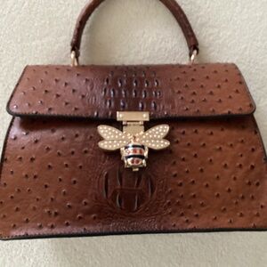 New.  Great with any outfit faux croc purse.  Includes wallet and shoulder strap
